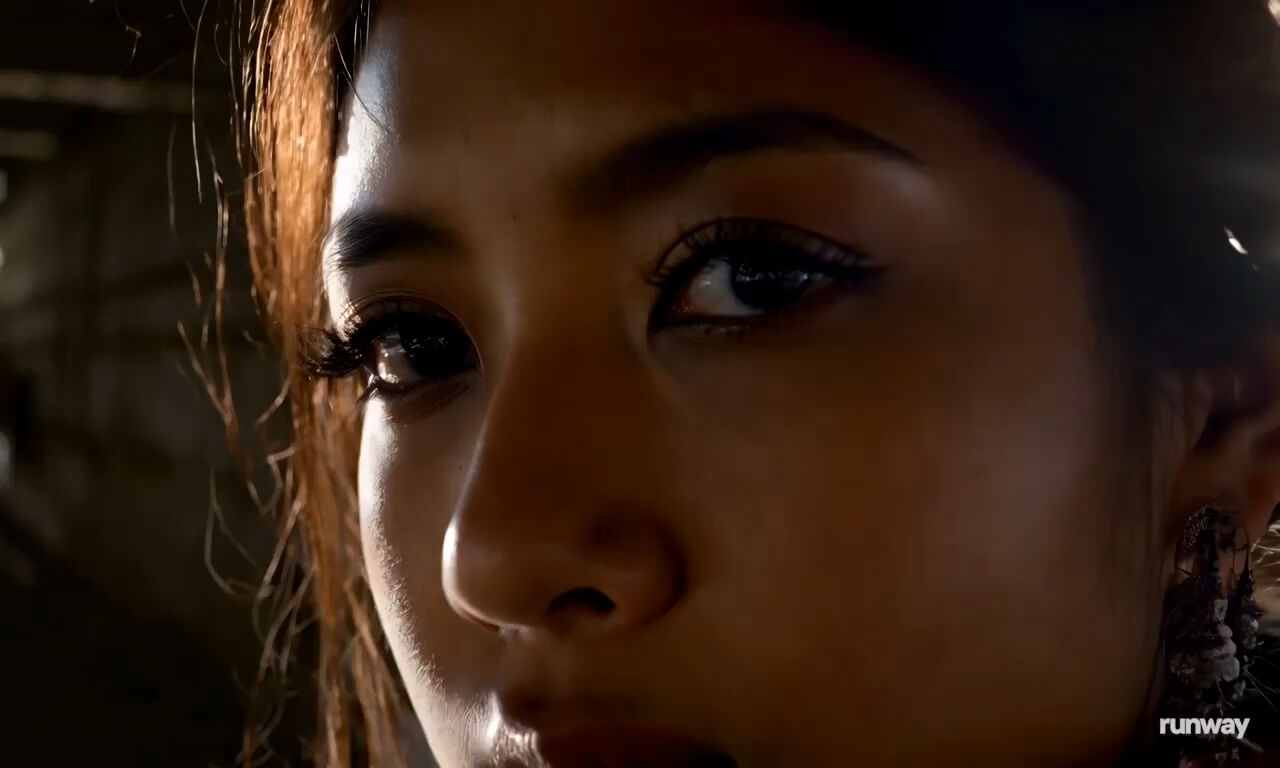 A close up portrait of a woman lit by the side