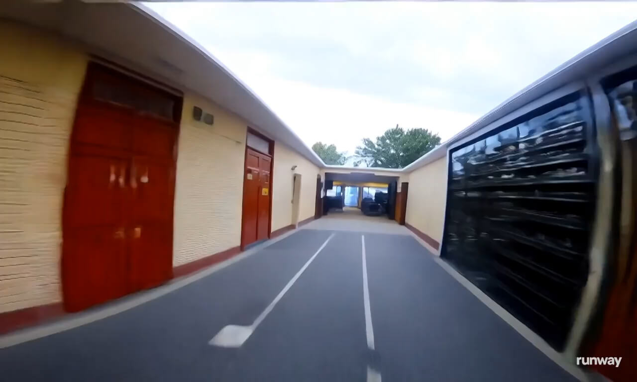 A first-person POV shot rapidly flies towards a house's fron